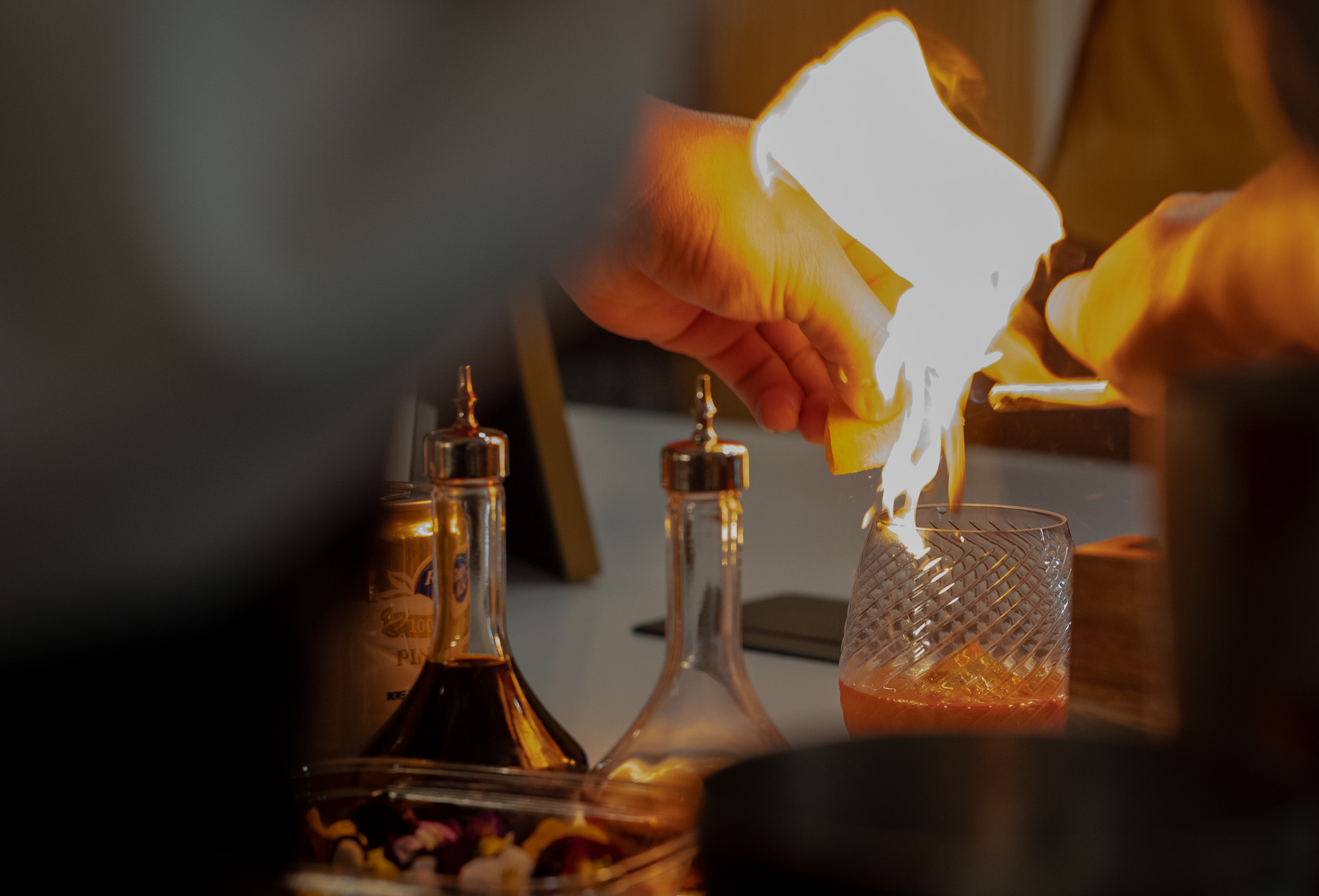 Sidecar Spirits bartender pouring a craft cocktail